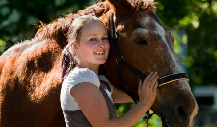 Girl at therapeutic boarding school with horse